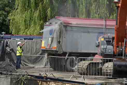 Hosing muck off lorry
