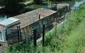 Security fence protecting moored boat